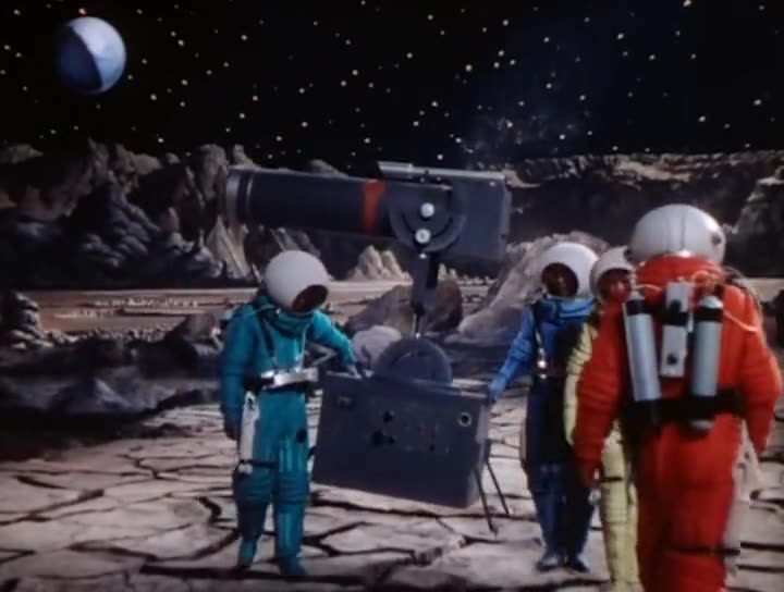 A frame from Destination Moon (1950), showing four astronauts on the lunar surface, in the film's original 4:3 frame.